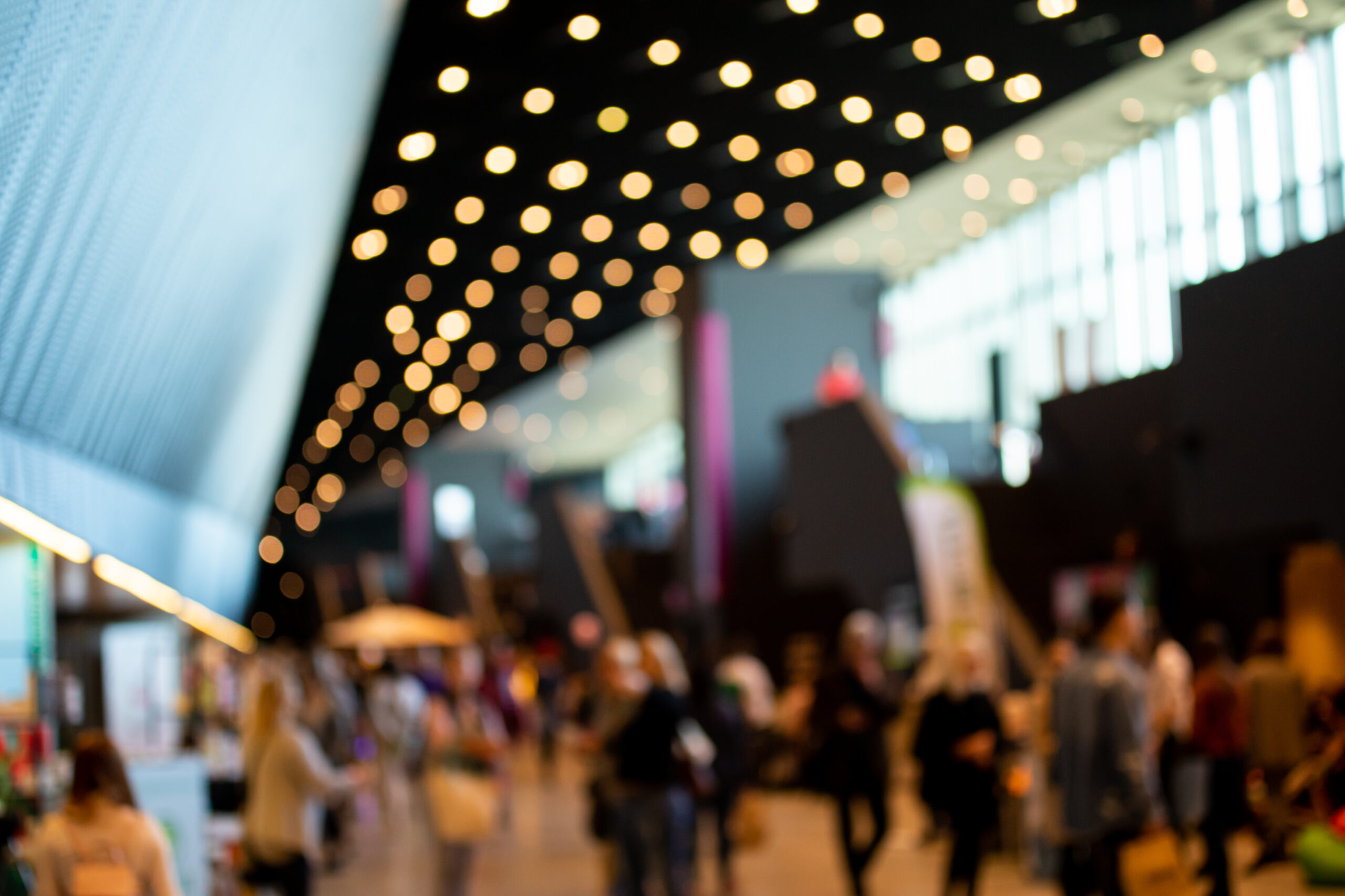 Blurred crowd of people in modern interior during Blurred crowd of people in modern interior during